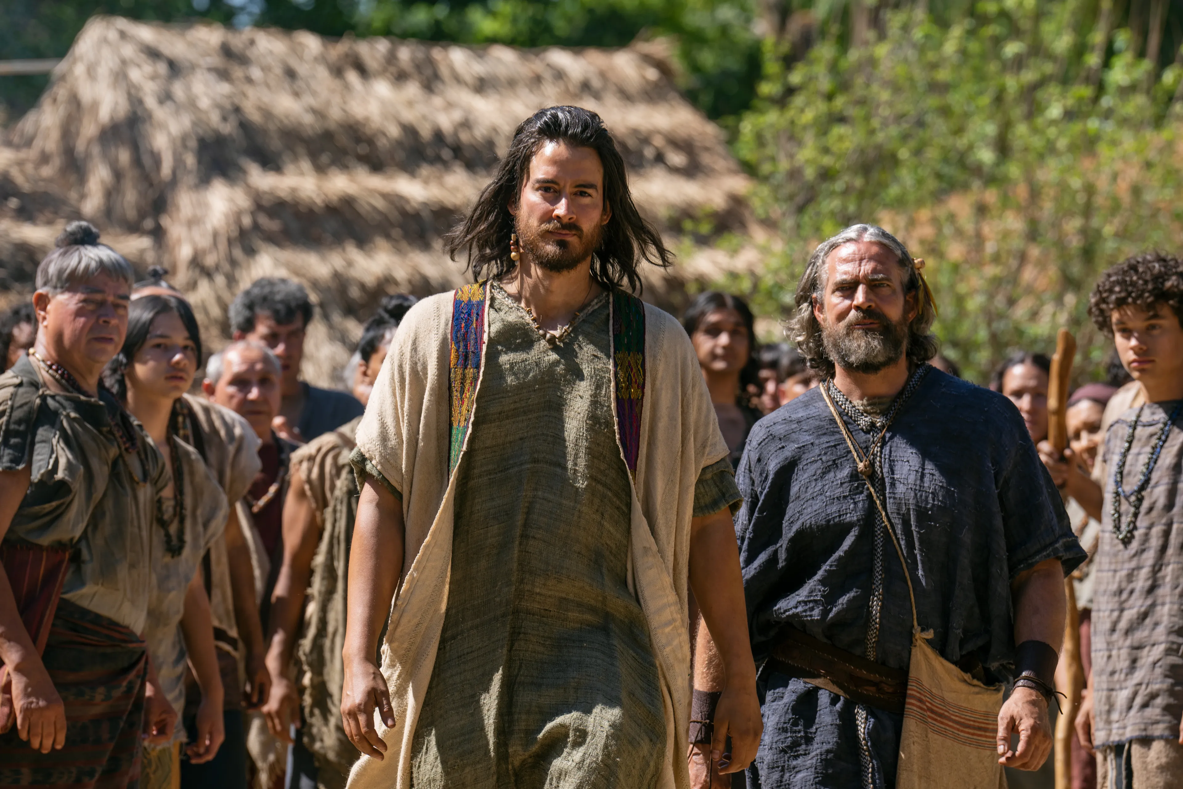 Alma walks through a crowd of people to speak to the Lamanites.