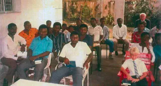members meeting in Nkitabungi’s garage