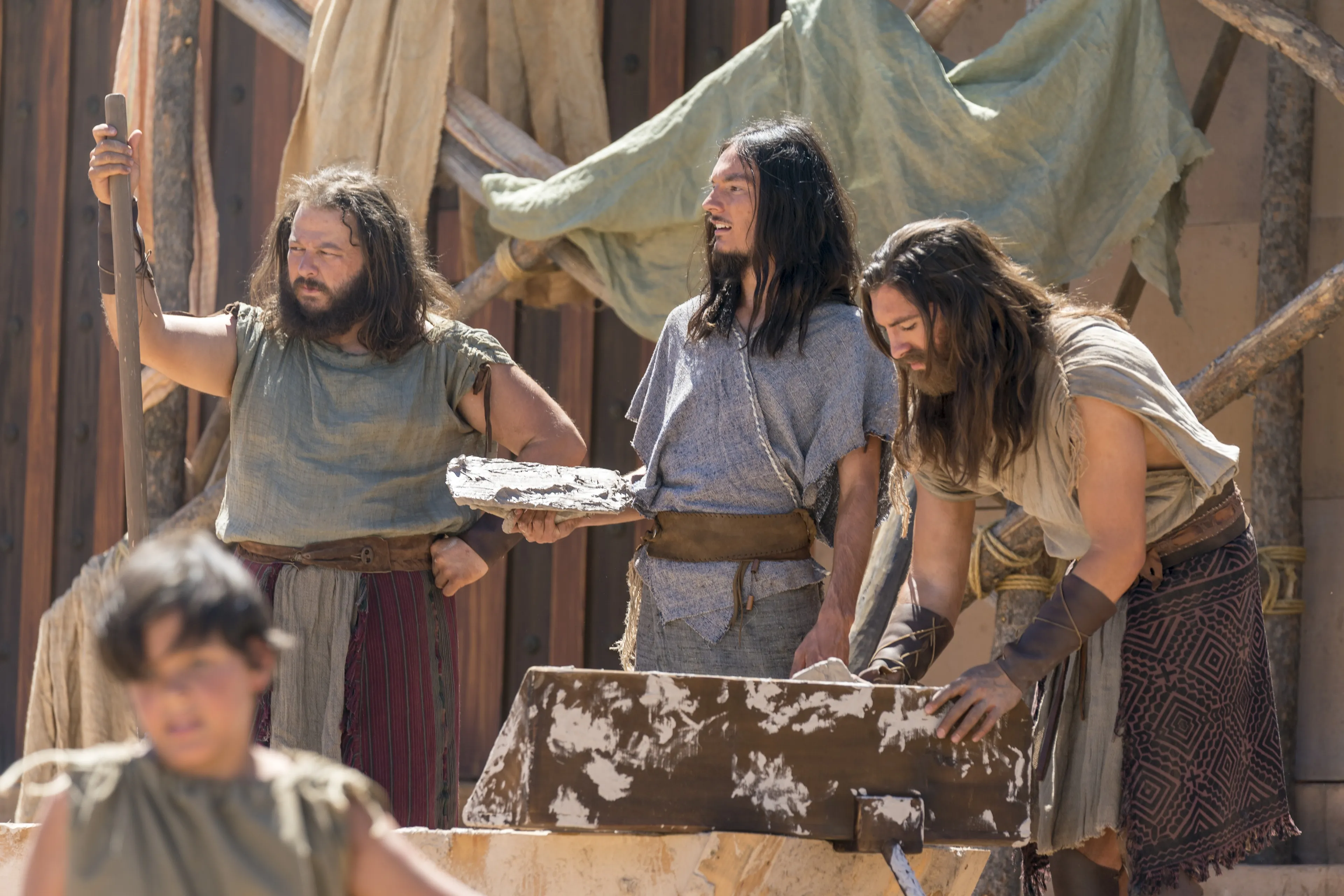 Nephi, Sam and Zoram work to build the temple in the Land of Nephi.