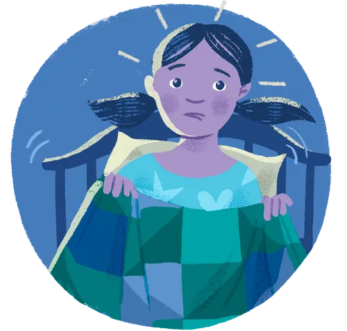 Little girl startled awake in bed holding a blanket 