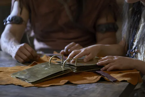 Enos and his wife study the plates.