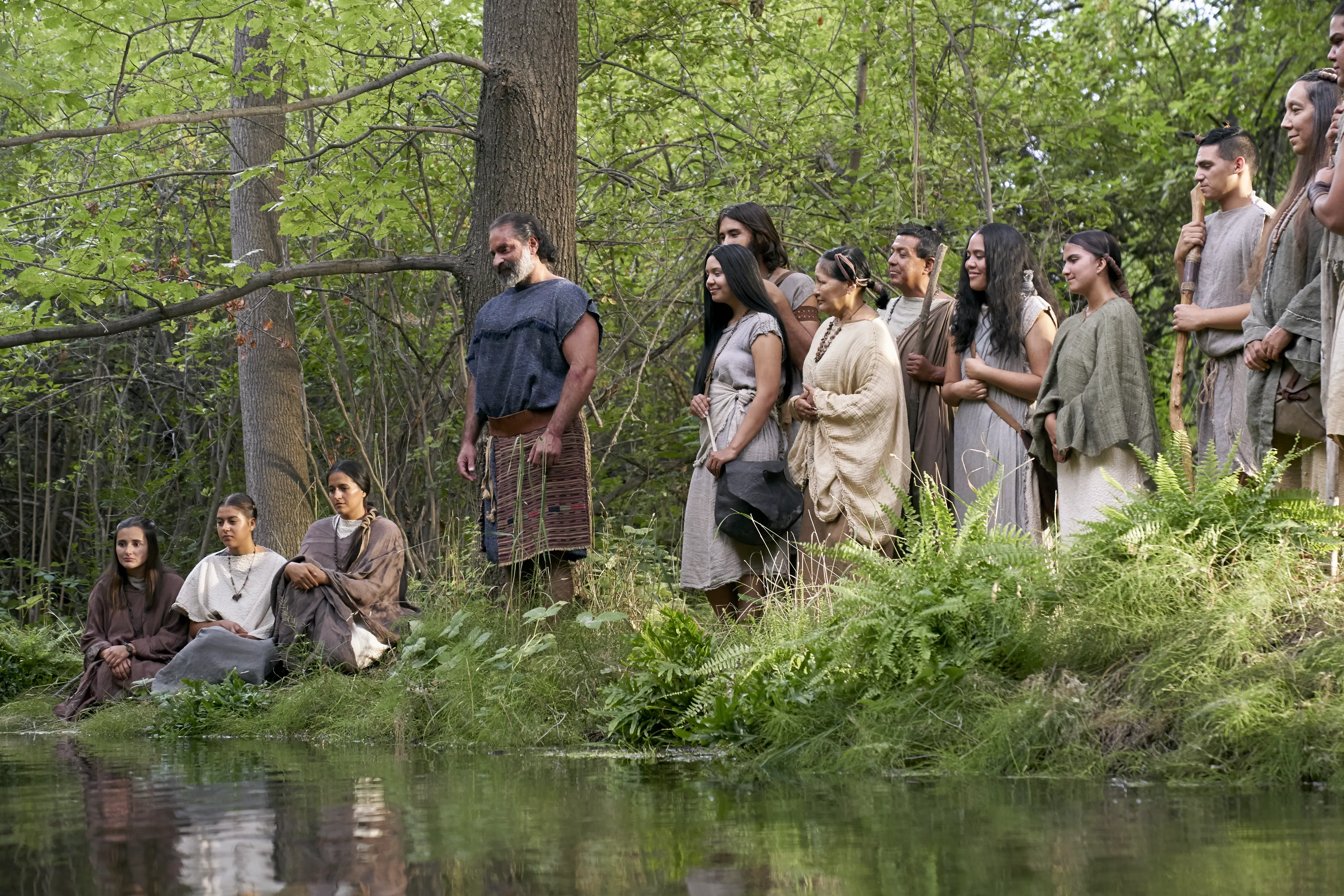 Amulek and others watch as Zeezrom is baptized.