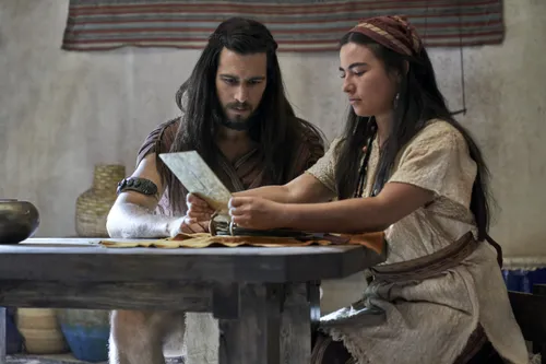 Enos and his wife study the plates.