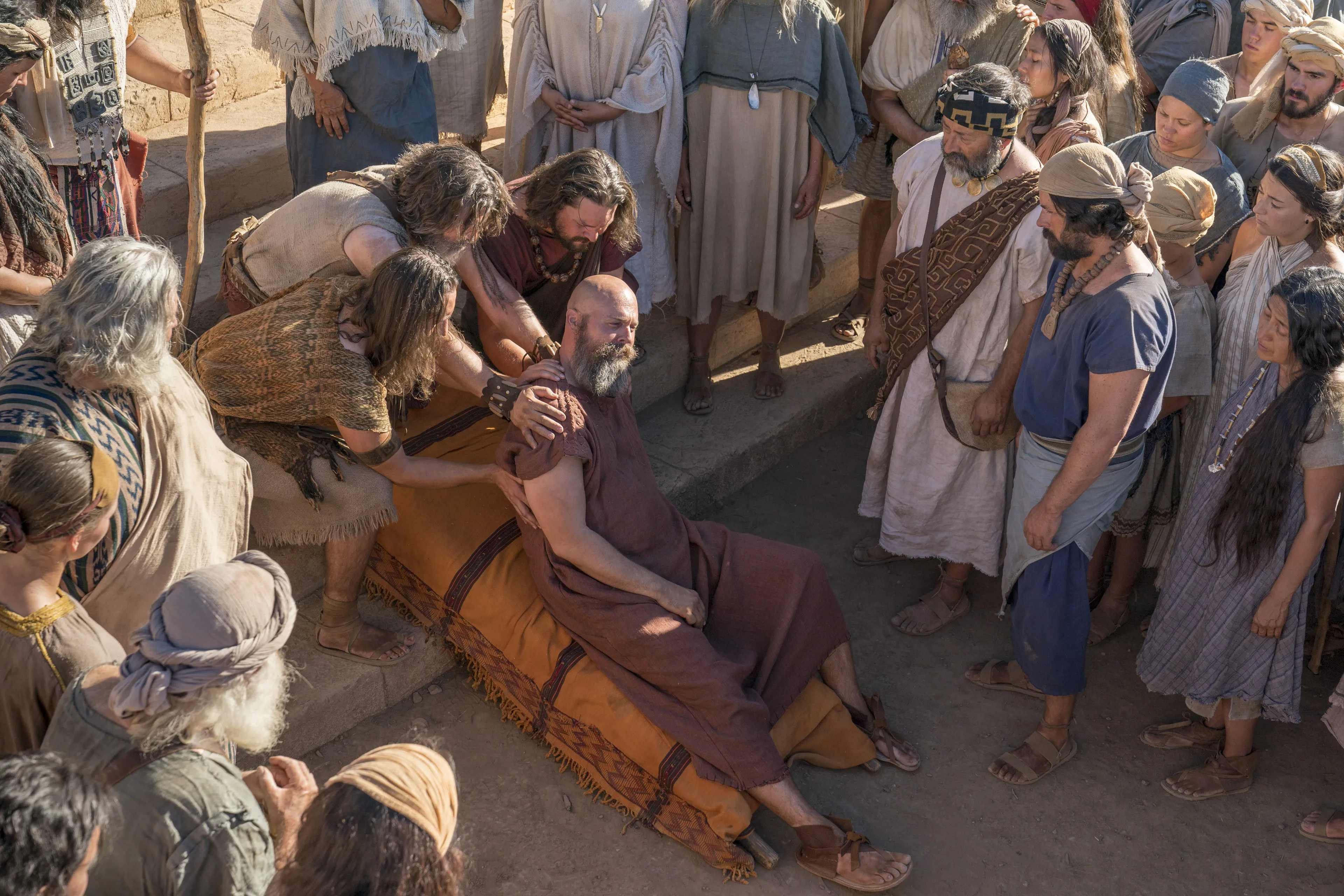 Nephites carry Sherem after he was struck down as a sign from God.