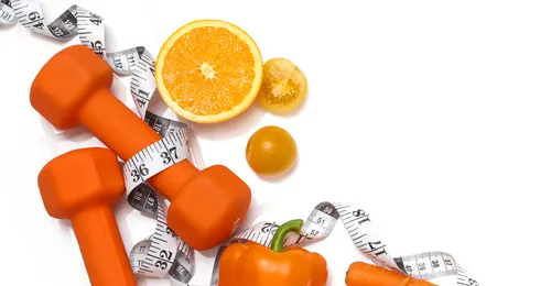 weights, measuring tape, and fruits and vegetables