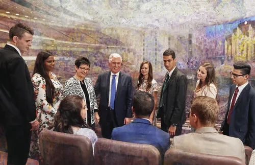 Elder and Sister Uchtdorf with young adults at the Conference Center