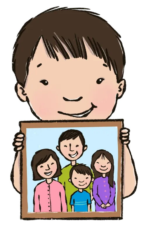 boy holding up picture of family