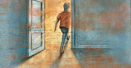 young man walking through doorway