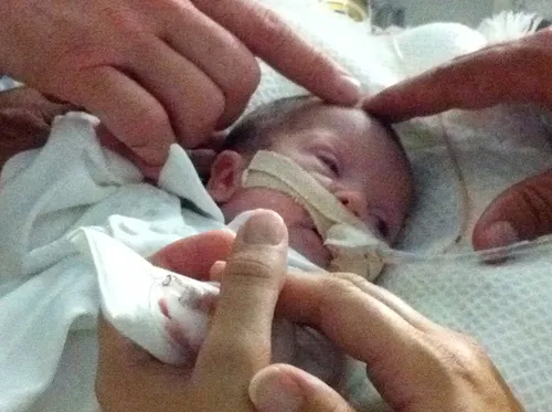 Giving a blessing to Elder Rasband’s grandson