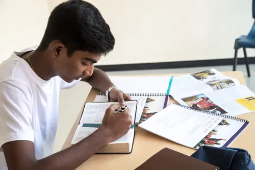 Young man reading scriptures