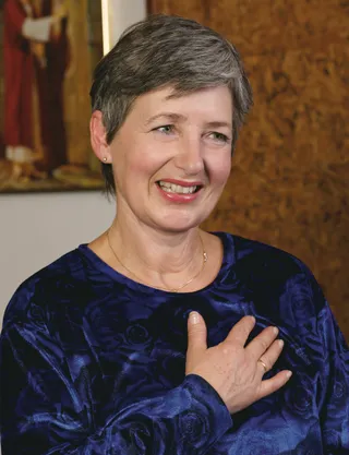 Primary teacher with her hand over her heart