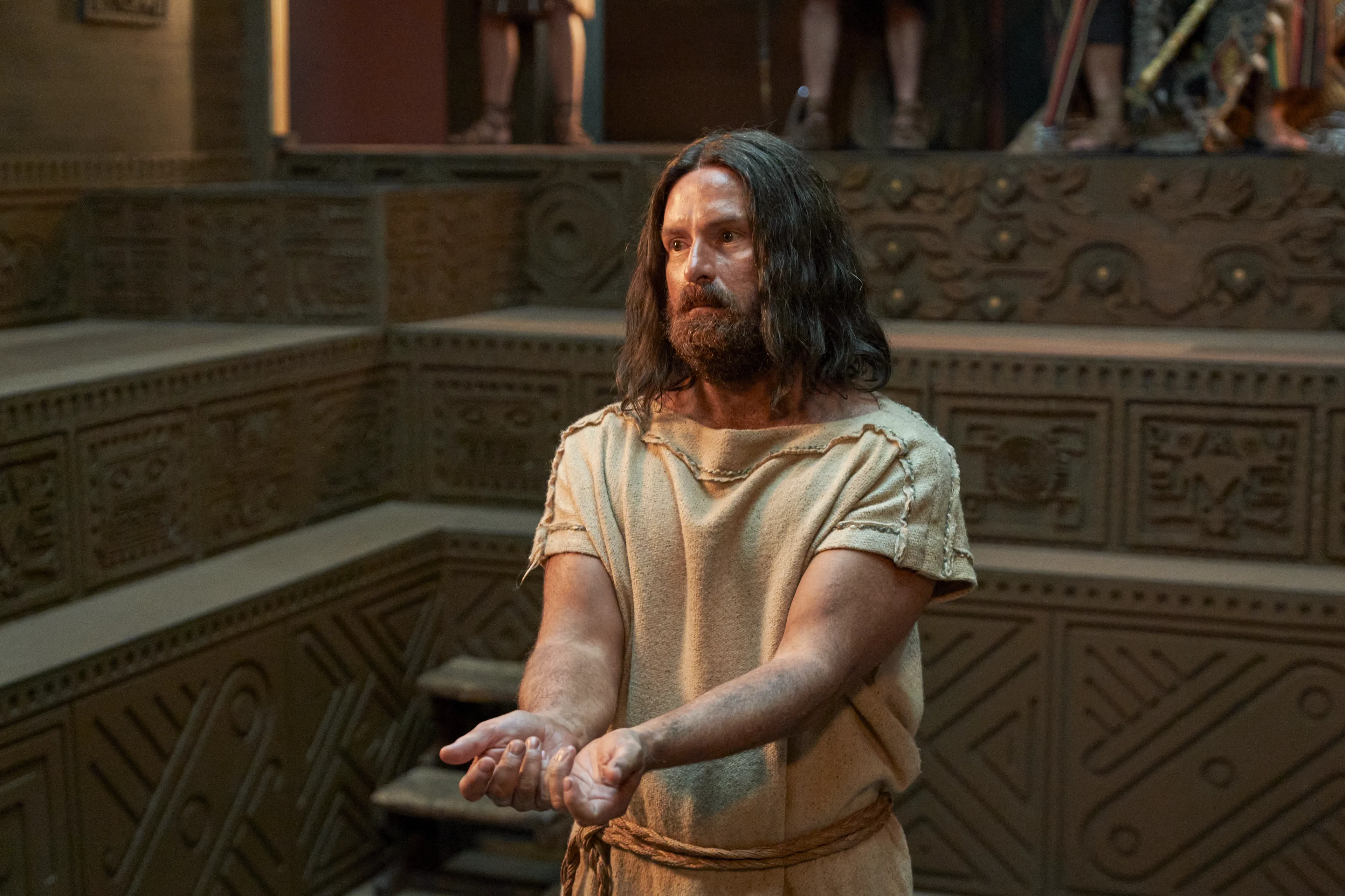 Abinadi is questioned by priests before King Noah.