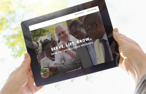 tablet with image of people cutting ribbon