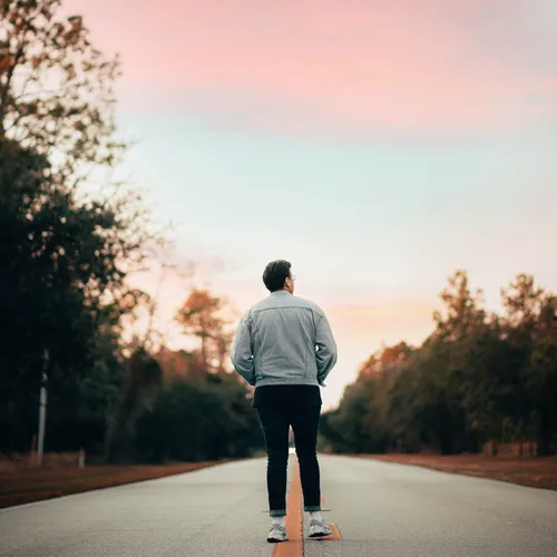 man looking into the sunset