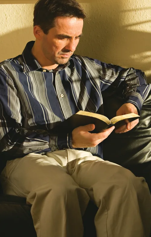 man reading book
