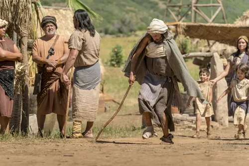 A disabled man walks toward the temple.