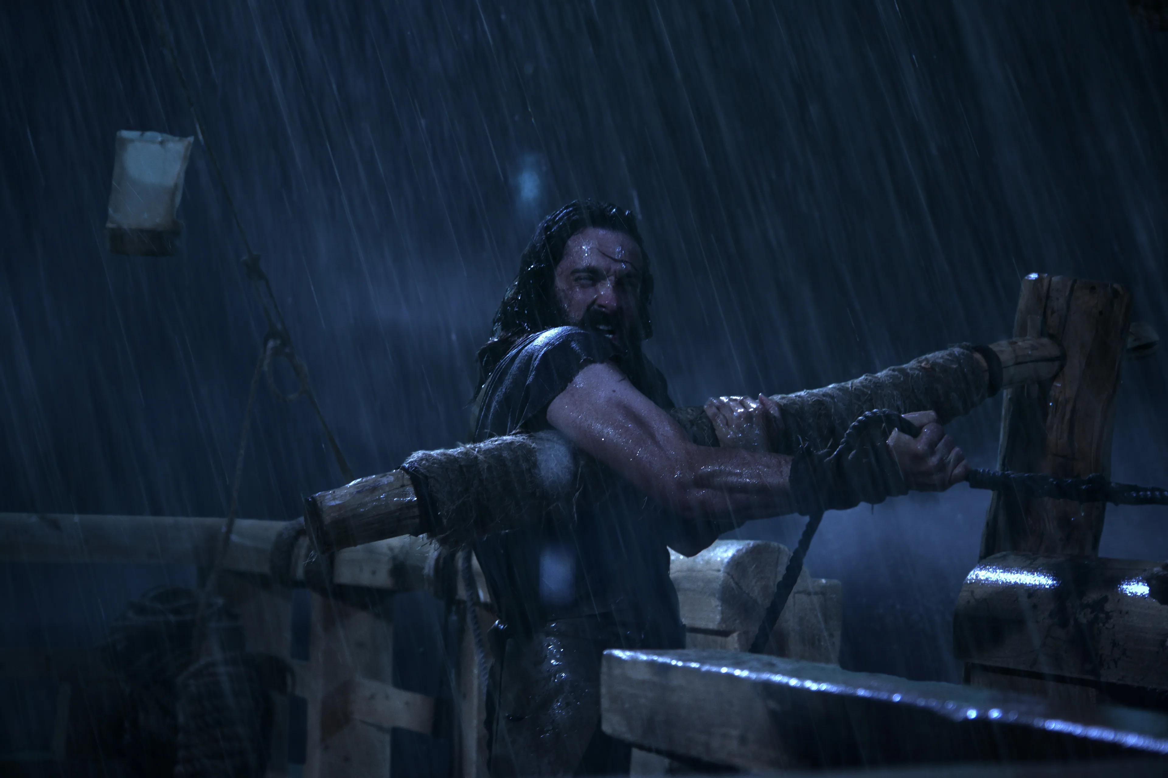 Lemuel attempts to guide the ship during the storm.