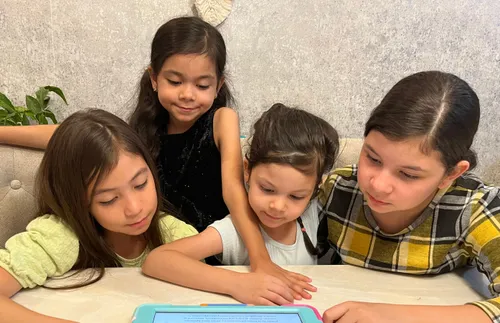 children looking at a tablet