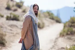 Jesus Christ walking down a path invites men to come unto Him