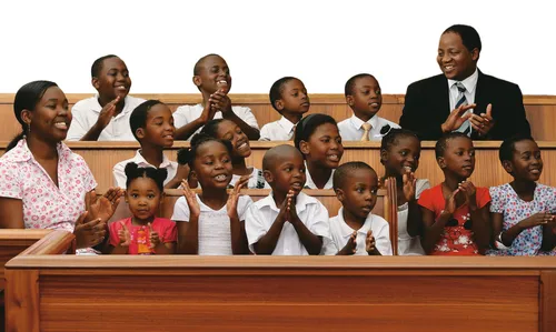 children and teachers in chapel