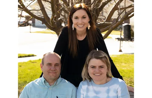author with couple who ministered to her