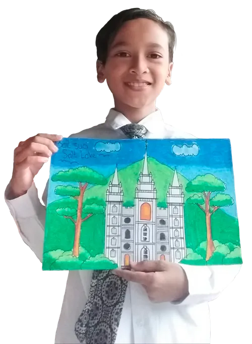 boy holding drawing of the temple