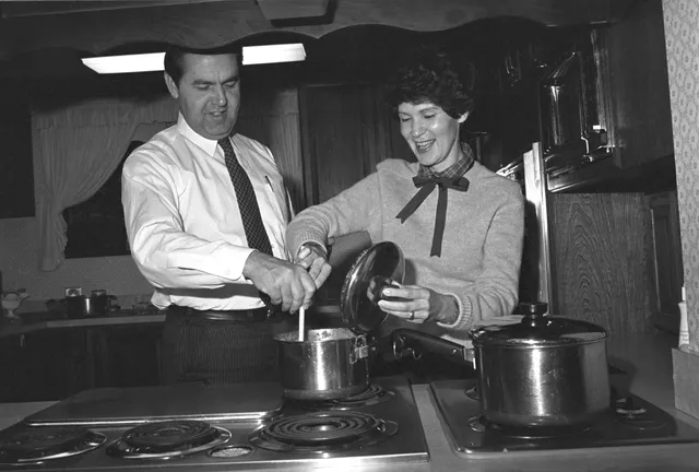 Jeffrey R. Holland and his wife, Patricia, enjoy a moment cooking together, November 11, 1980.
