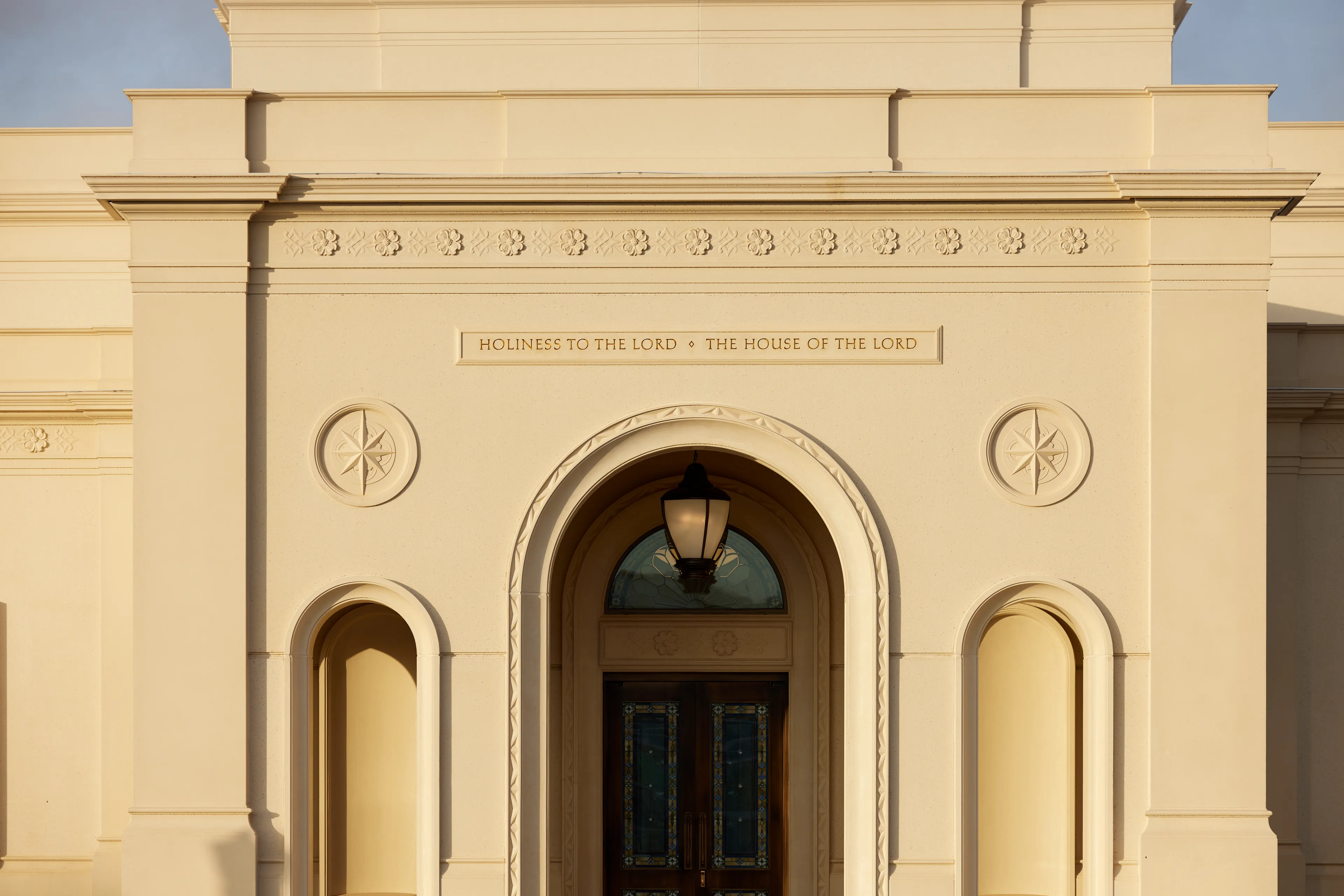 An exterior image of the Bentonville Arkansas Temple. Image features the architectural details of the stone work.