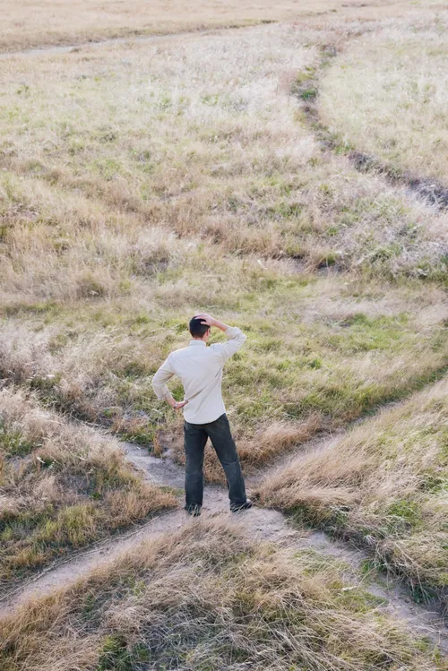 Man standing at crossroads
