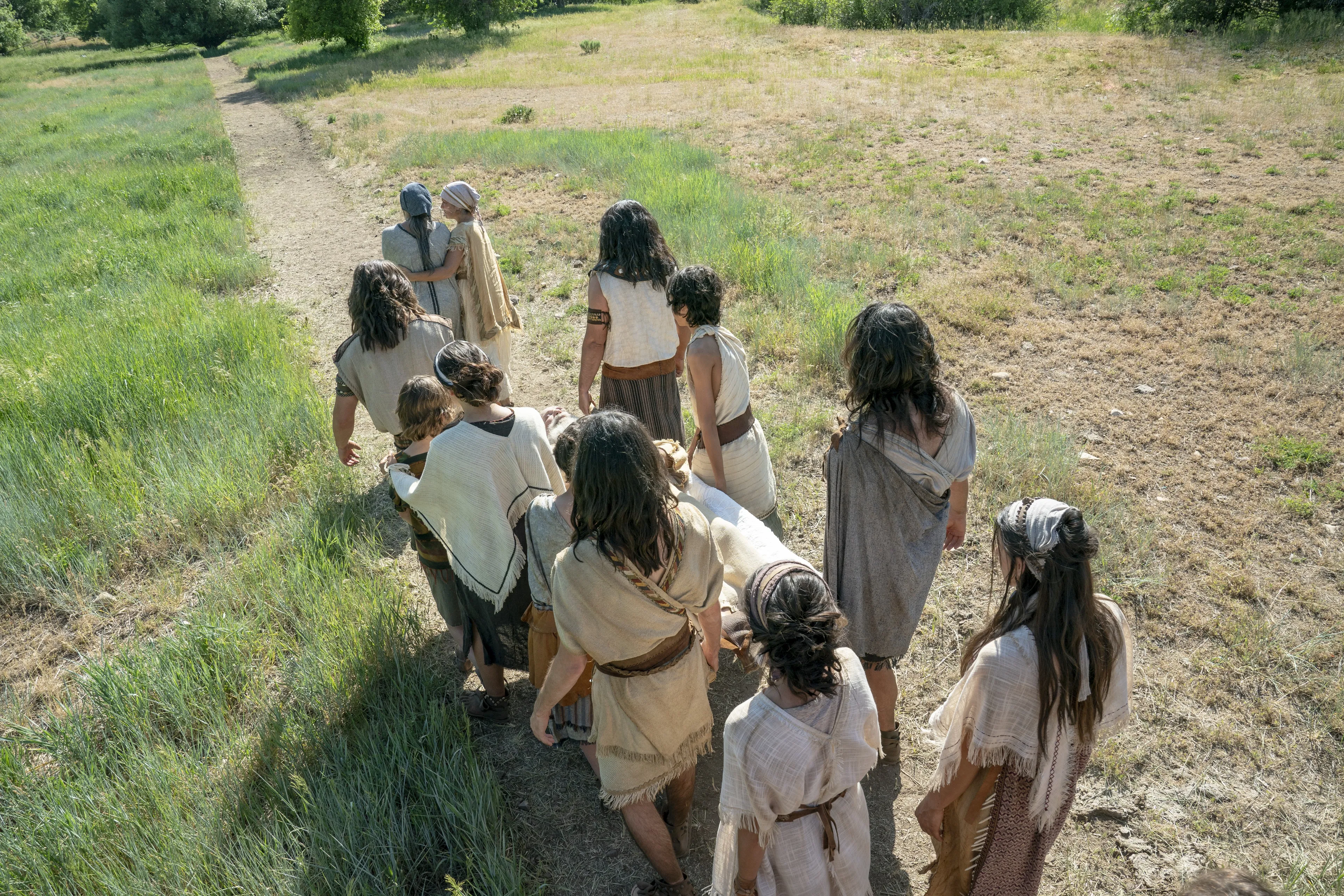 Lehi's family carries his body to his burial.