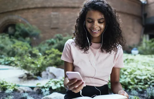 young woman looking at smartphone