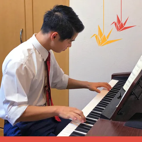 young man playing piano