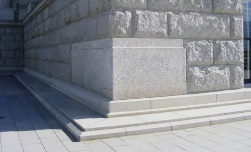 A photo of a cornerstone in a stone wall.