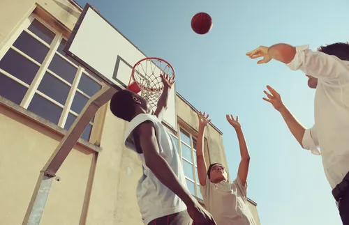 Boys playing basketball