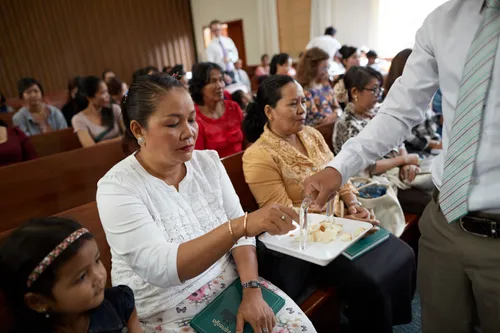 people partaking of the sacrament at church
