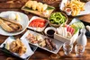 table filled with japanese and american dishes foods