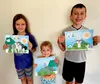 Image of two boys and a girl holding pictures they made