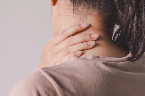 Woman with sore neck