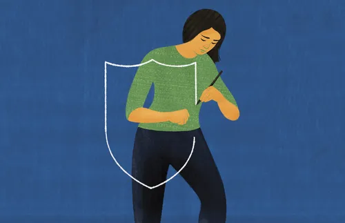 woman drawing a shield