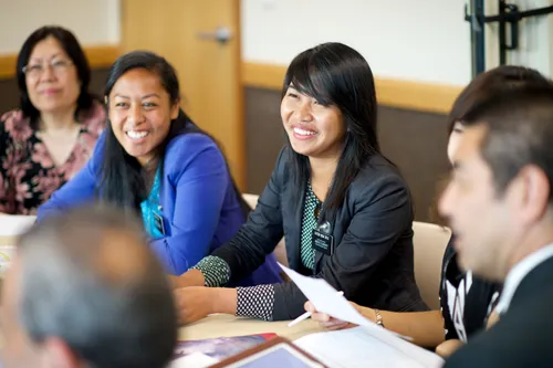 missionaries sitting around a table