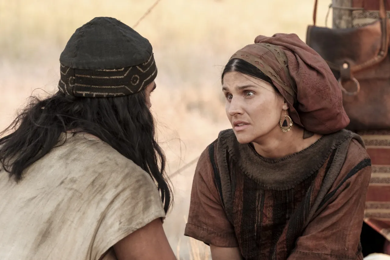 Laman and his wife talk at the camp in the wilderness.