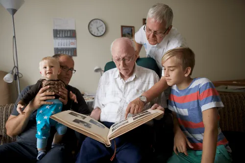 family looking at album