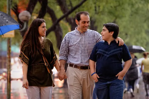couple walking with teenage son