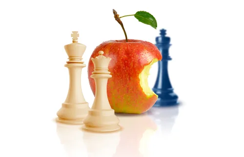 chess pieces and an apple