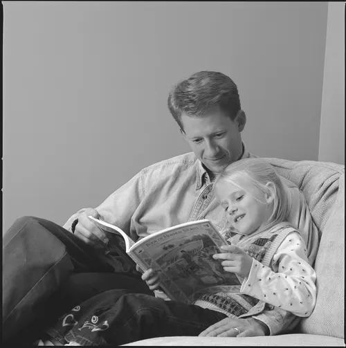father and daughter reading