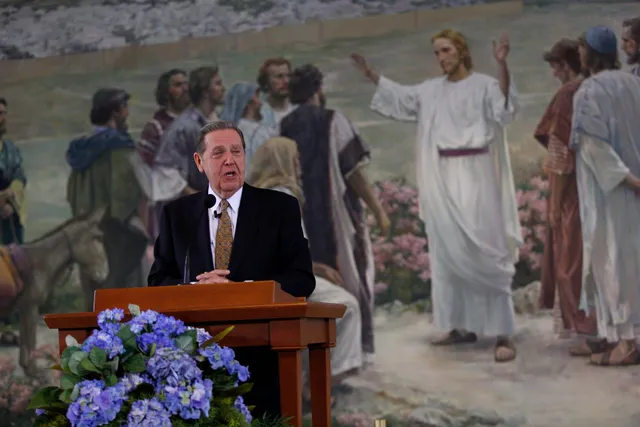 Elder Holland speaks at a press conference on October 6, 2012, in the lobby of the Church Office Building. Earlier that day, Church President Thomas S. Monson announced that men could begin serving as missionaries at age 18 and women at age 19.