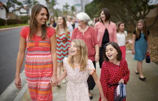 women walking to church