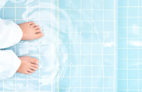 feet in baptismal font