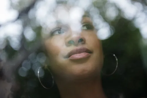woman looking out window