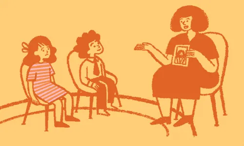 Children sitting in Primary class with a woman teaching